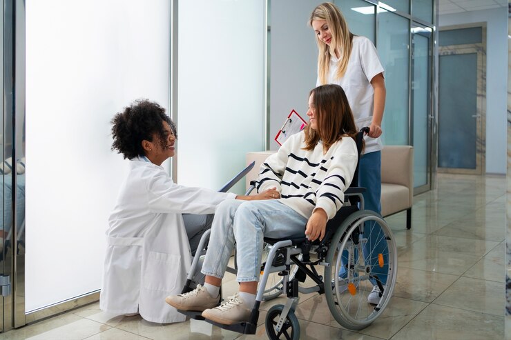 Physiotherapist assisting a client with rehabilitation exercises to improve mobility